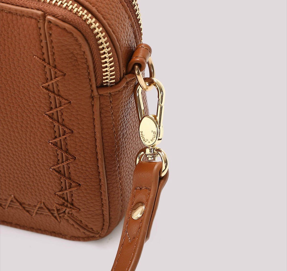BORSA A TRACOLLA CON CUCITURE A VISTA MISURA MINI-MIMI’ MUA’